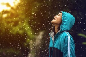 Girl enjoying the rain